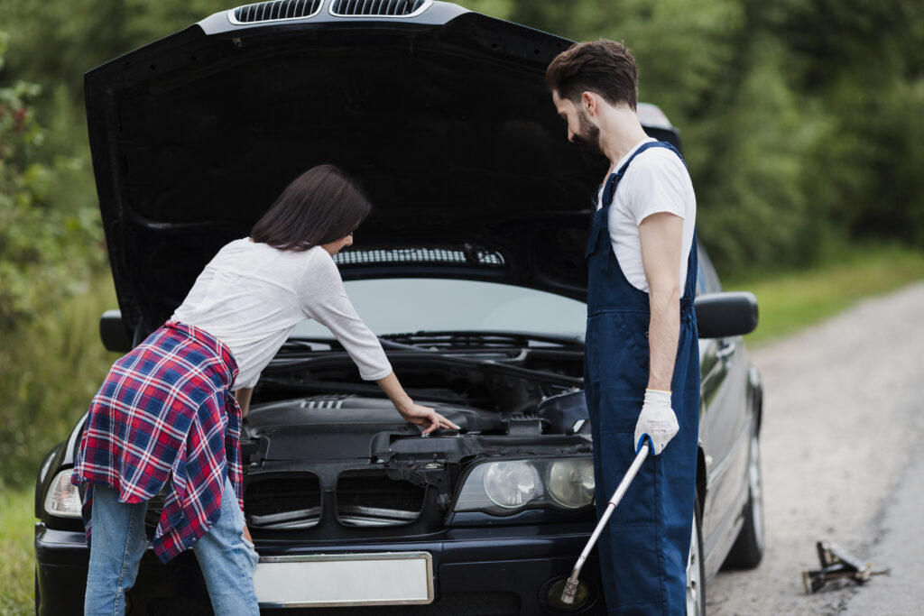 The mobile mechanics is fixing the car in the roadside